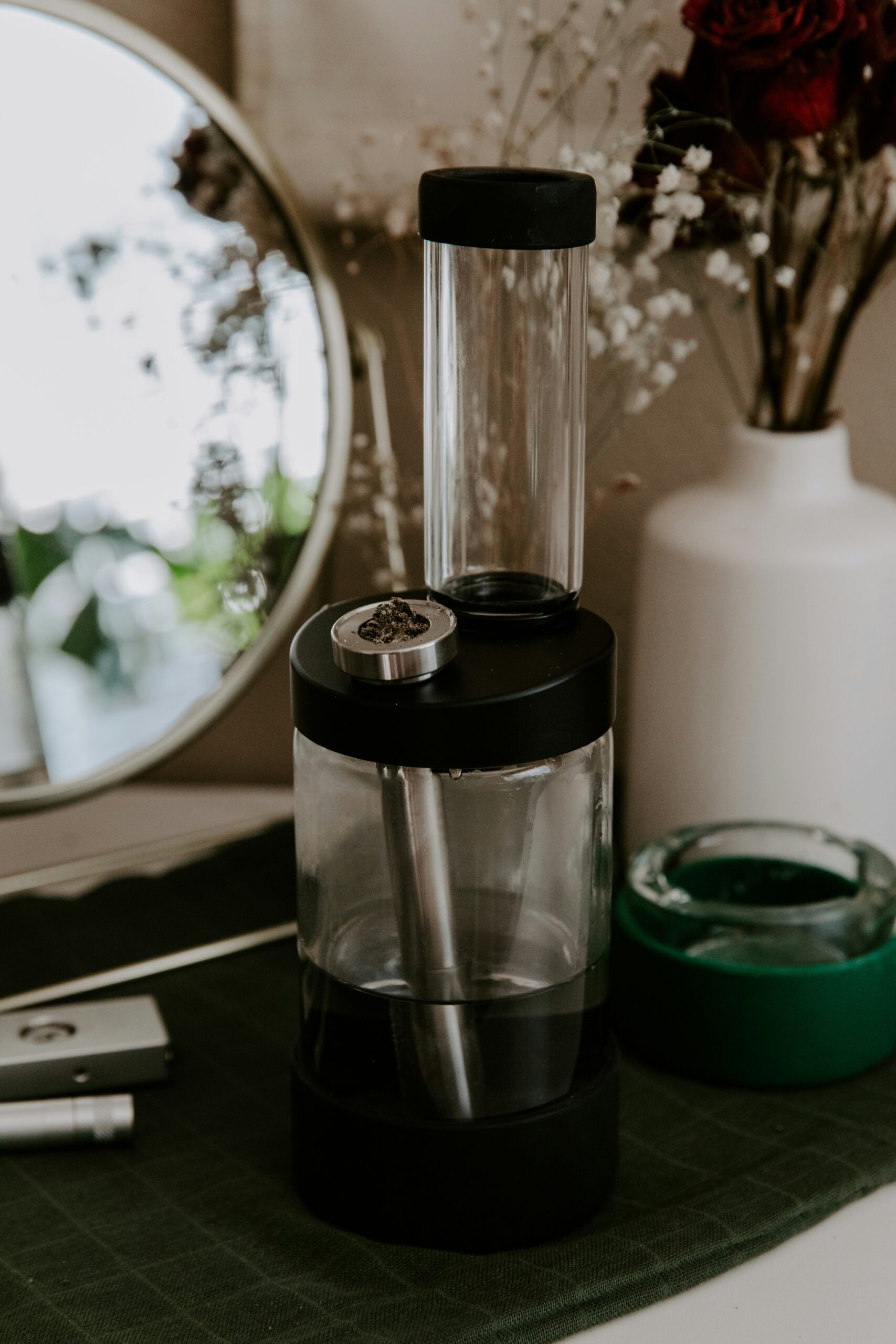 glass bong sitting in a room