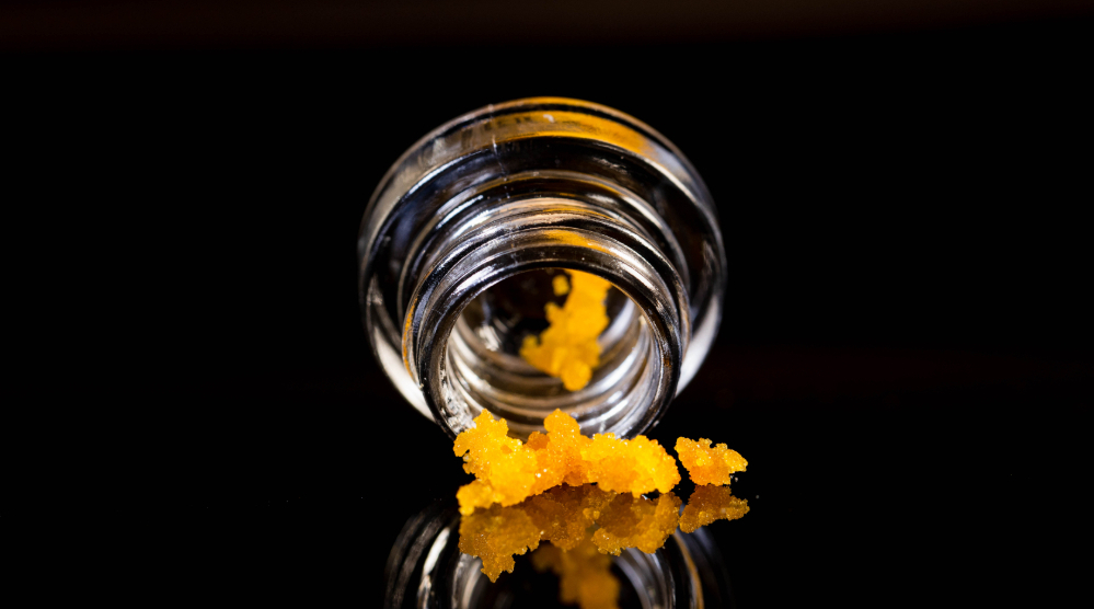 Cannabis concentrate in a spilled over jar